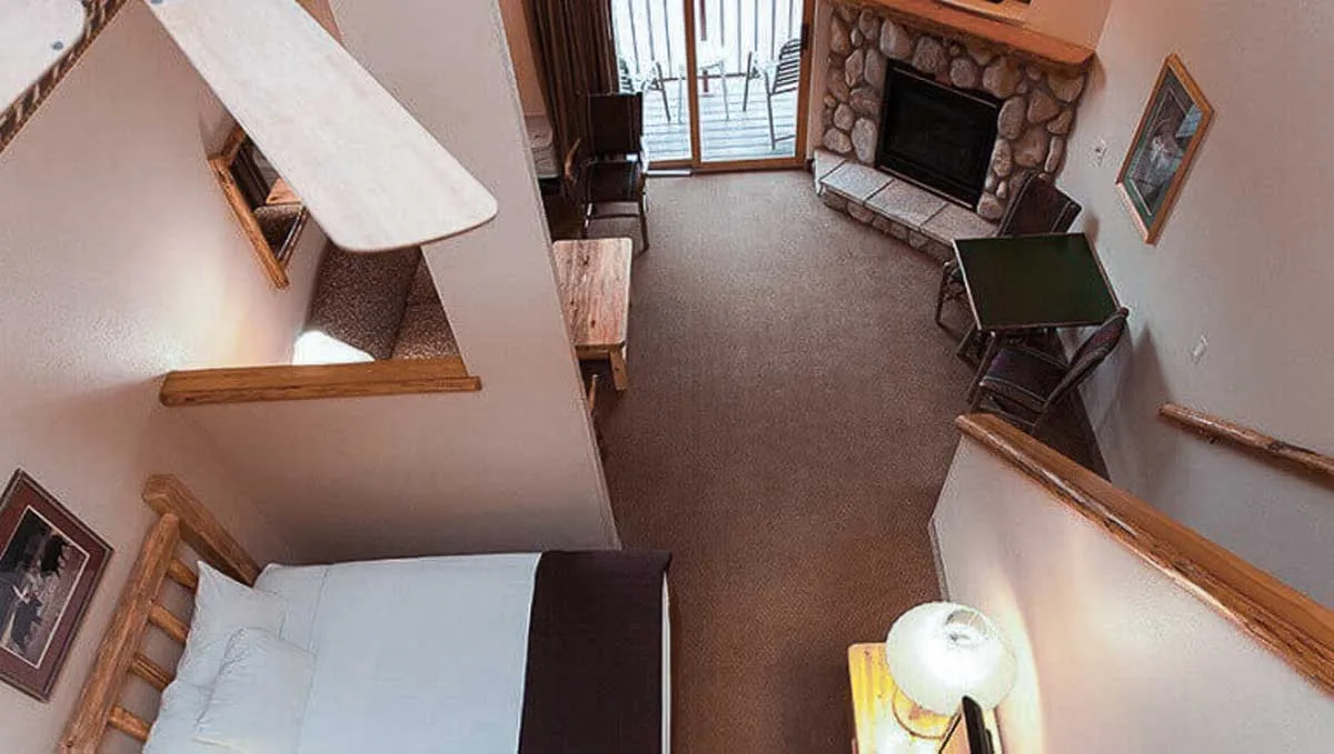 The view from the loft down into the living space in the Loft Fireplace Suite accessible